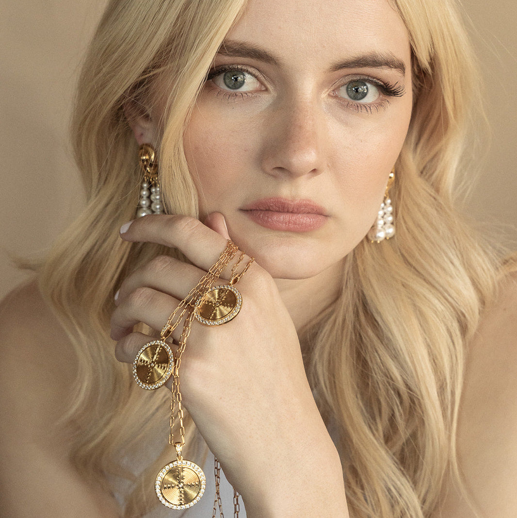 Close-up of Sanctum Necklace pendant with 'Credere in Processu' inscription